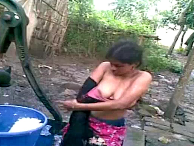 Dp fhg 923 Indian babe taking open air shower unaware of